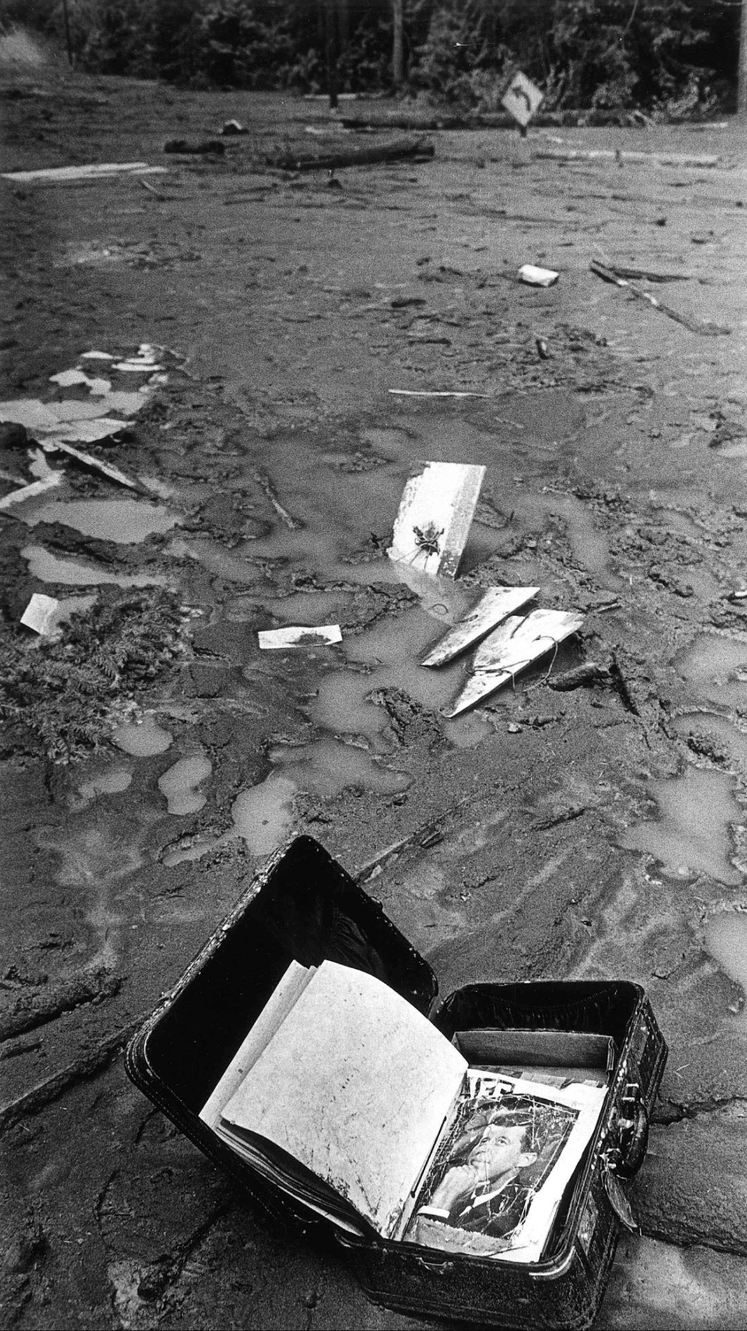 Suitcase in mud